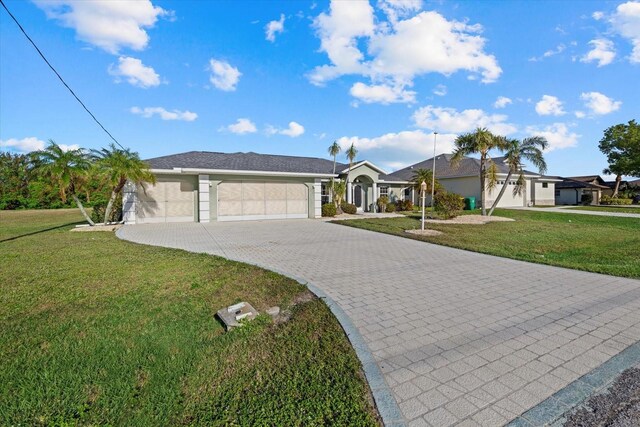 ranch-style house with a garage and a front lawn