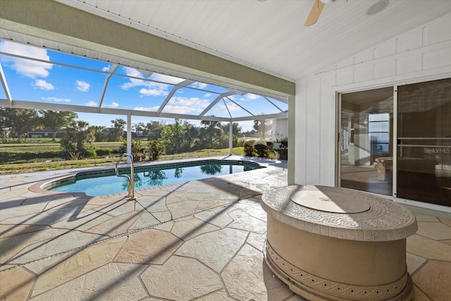 52 Fairway Rd, Rotonda West, FL 33947 - outdoor pool featuring a patio area, a ceiling fan, and glass enclosure