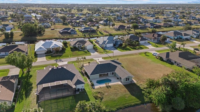 52 Fairway Rd, Rotonda West, FL 33947 - aerial view of property and surrounding area with nearby suburban area and a pool