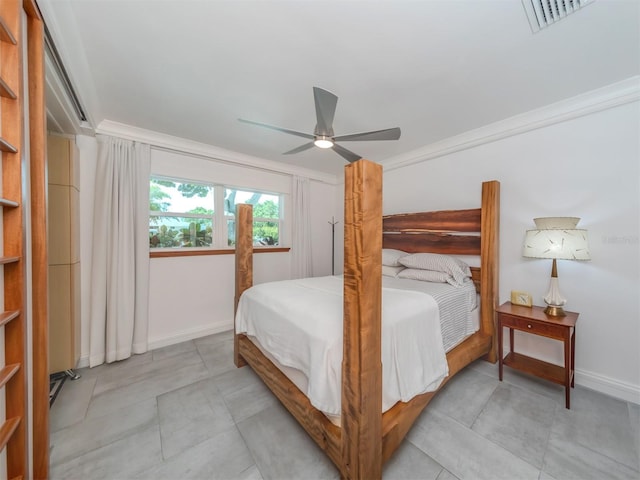 bedroom with ceiling fan and crown molding