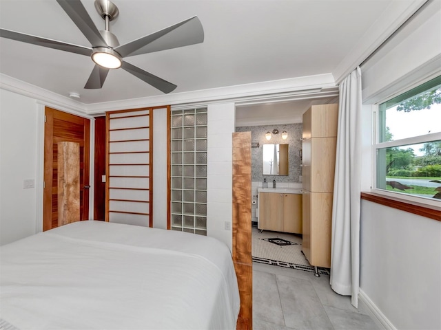 bedroom featuring ensuite bathroom and ceiling fan