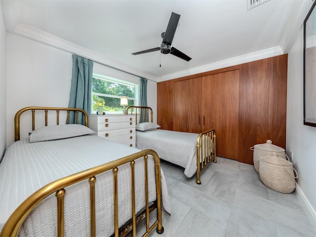 bedroom featuring ceiling fan and ornamental molding