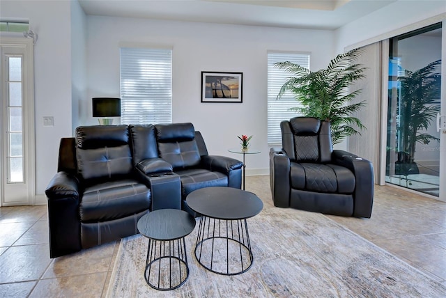 tiled living room with plenty of natural light