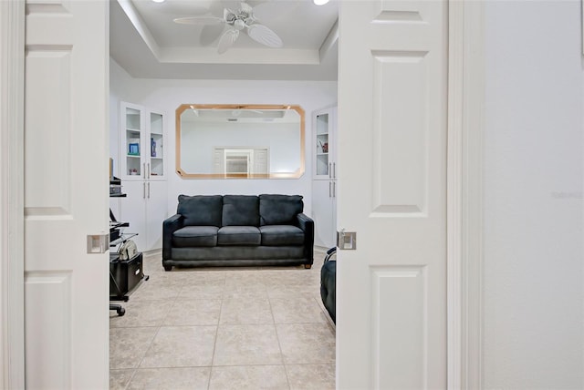 tiled living room with ceiling fan