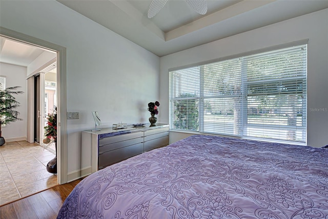 bedroom featuring light wood-type flooring and ceiling fan