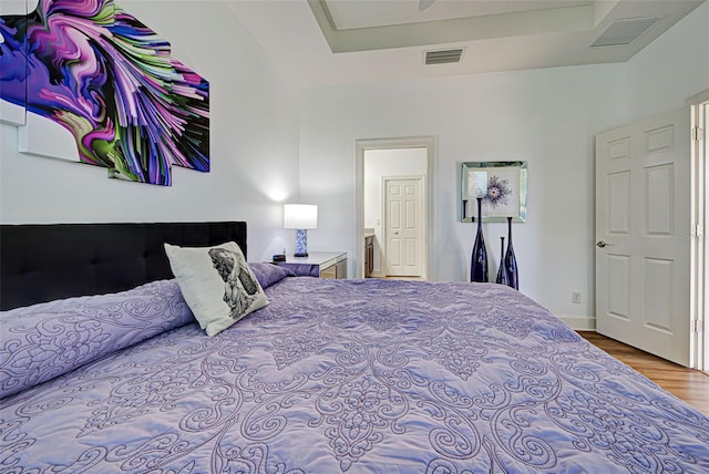 bedroom with wood-type flooring