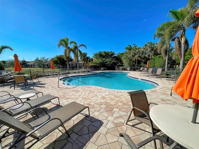 view of swimming pool featuring a patio area