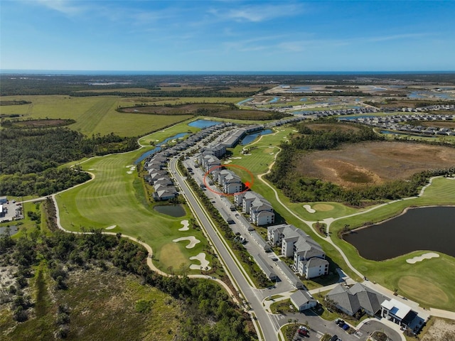 bird's eye view featuring golf course view and a water view