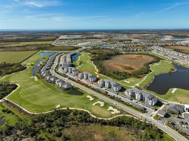 aerial view featuring a water view and golf course view