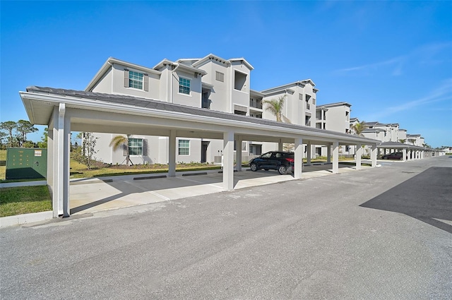 covered parking lot with a residential view