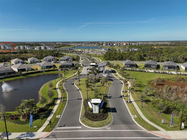 birds eye view of property featuring a water view and a residential view