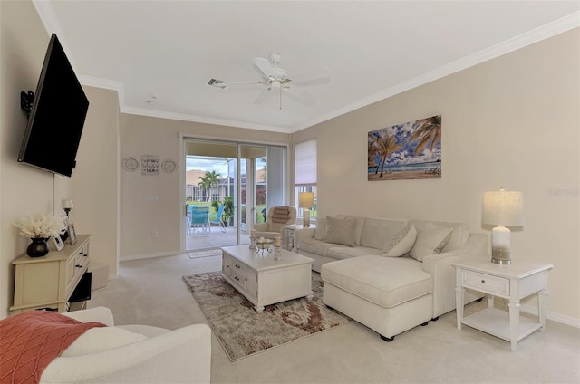 living room with ceiling fan, light colored carpet, and ornamental molding