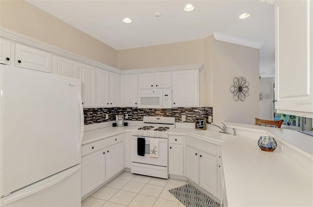 kitchen with backsplash, white cabinetry, white appliances, and sink