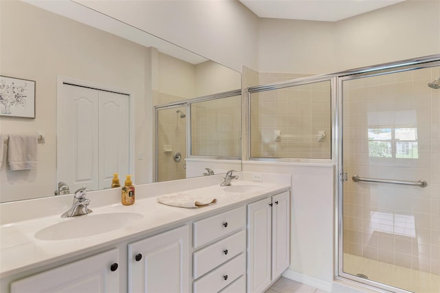 bathroom featuring vanity and an enclosed shower