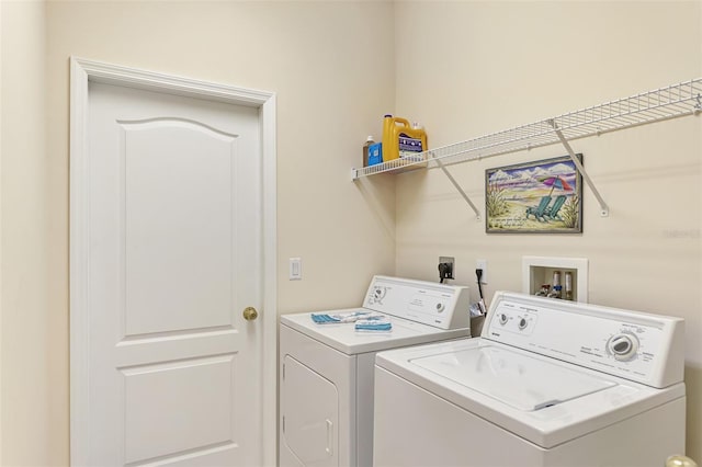 laundry area featuring washing machine and clothes dryer