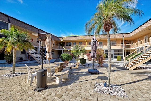 surrounding community featuring a patio