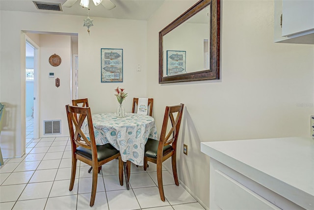 tiled dining area with ceiling fan