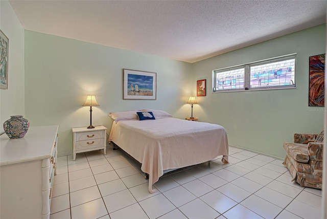 tiled bedroom with a textured ceiling