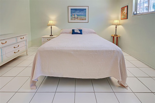 bedroom featuring light tile patterned flooring