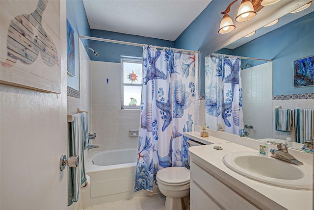 full bathroom with vanity, tile patterned floors, toilet, shower / bath combo with shower curtain, and tile walls