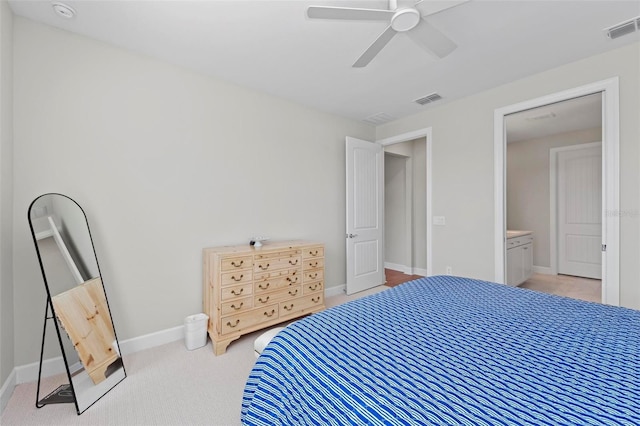 carpeted bedroom with ceiling fan and connected bathroom