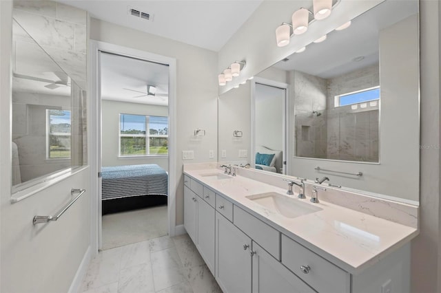 bathroom featuring ceiling fan, walk in shower, and vanity