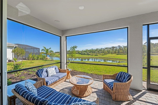 sunroom / solarium with a water view