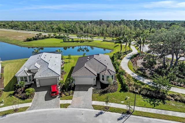 birds eye view of property with a water view