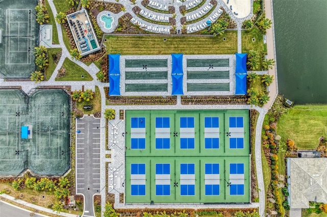 birds eye view of property with a water view