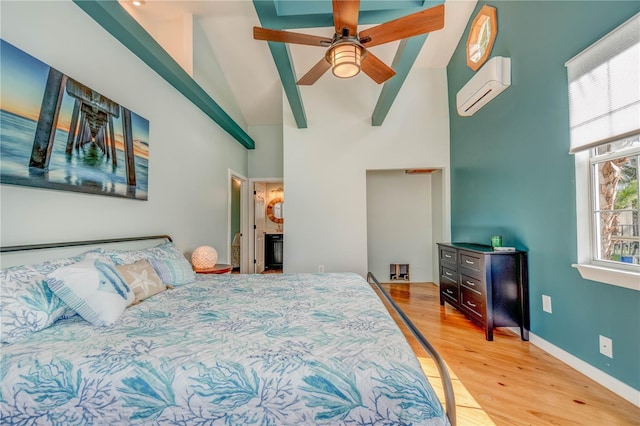 bedroom with a wall mounted AC, ceiling fan, high vaulted ceiling, and light wood-type flooring