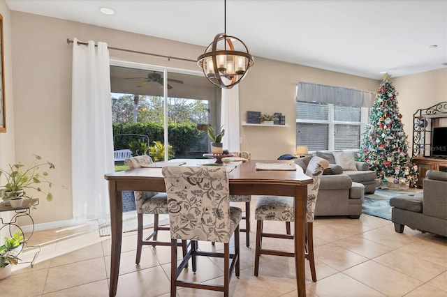 dining room featuring light tile patterned floors and a chandelier