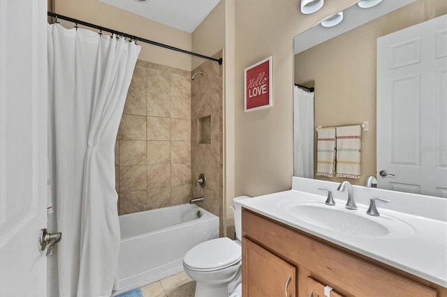 full bathroom featuring tile patterned flooring, vanity, toilet, and shower / tub combo