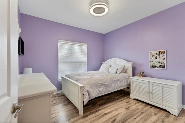 bedroom with light hardwood / wood-style floors