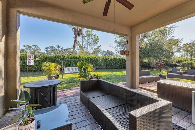 view of patio featuring an outdoor living space and ceiling fan