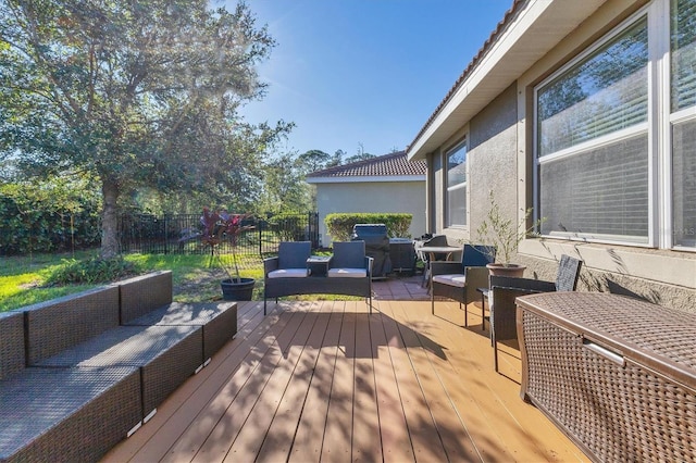 wooden deck featuring an outdoor hangout area