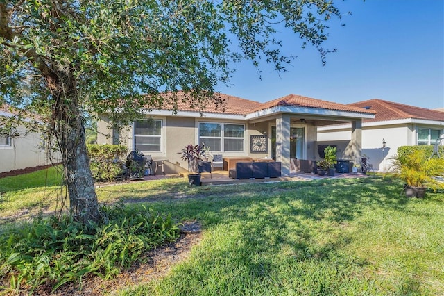 rear view of property with a lawn, a patio, and an outdoor hangout area