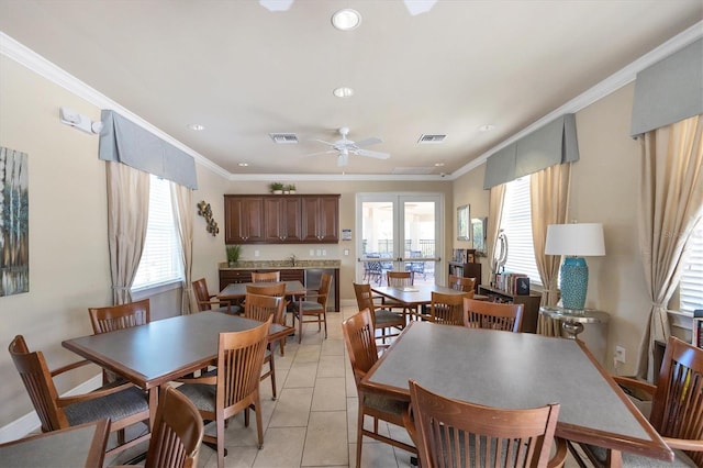 dining area featuring light tile patterned floors, french doors, ceiling fan, and ornamental molding