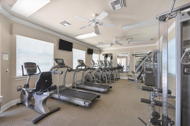 workout area with ceiling fan, a healthy amount of sunlight, and ornamental molding