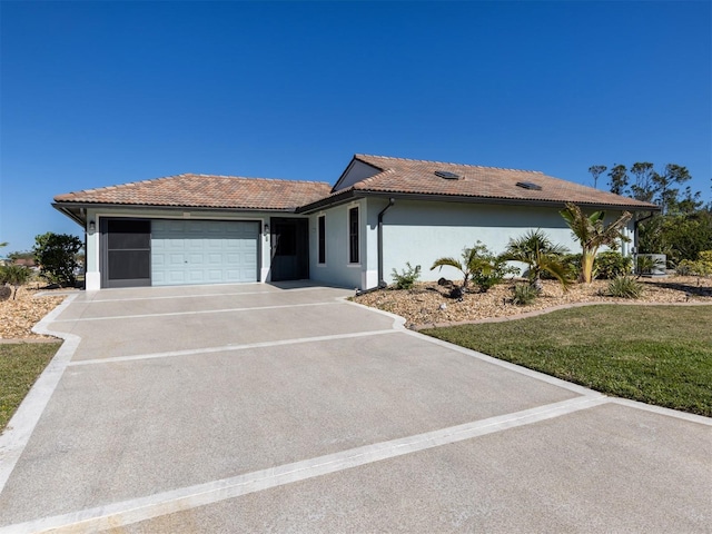 ranch-style home with a garage and a front yard