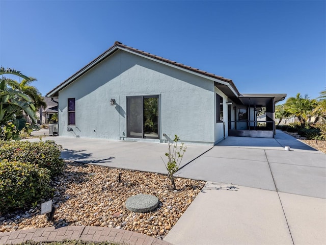 rear view of house featuring a patio