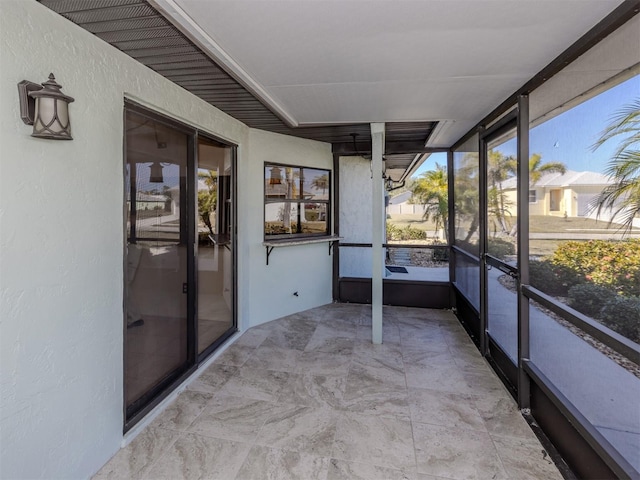 unfurnished sunroom with a healthy amount of sunlight