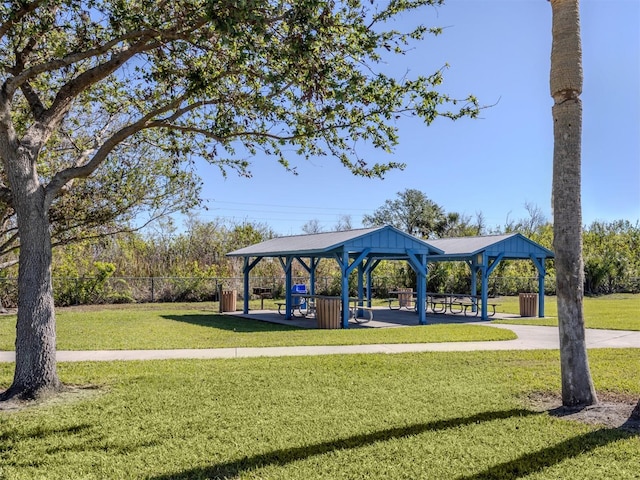 view of property's community with a gazebo and a lawn