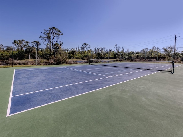 view of tennis court featuring basketball court