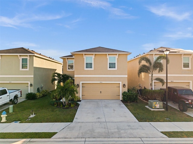 front of property featuring a garage and a front yard