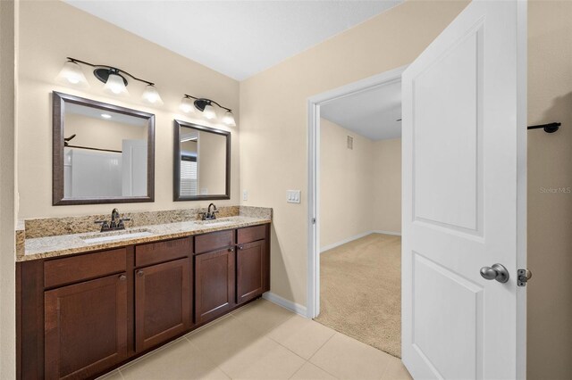 bathroom with tile patterned flooring and vanity