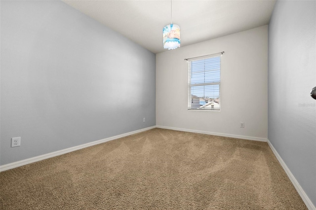 spare room featuring carpet