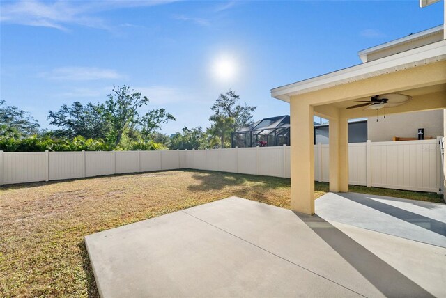 view of yard featuring a patio and ceiling fan