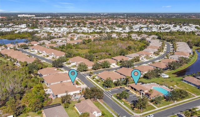 aerial view with a residential view and a water view