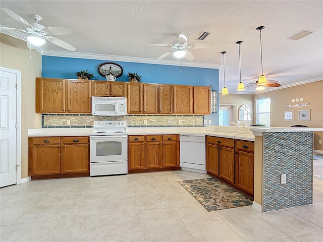 kitchen with a peninsula, white appliances, backsplash, brown cabinets, and crown molding