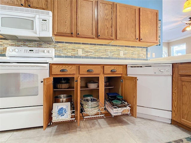 kitchen with ceiling fan, white appliances, light tile patterned floors, and tasteful backsplash